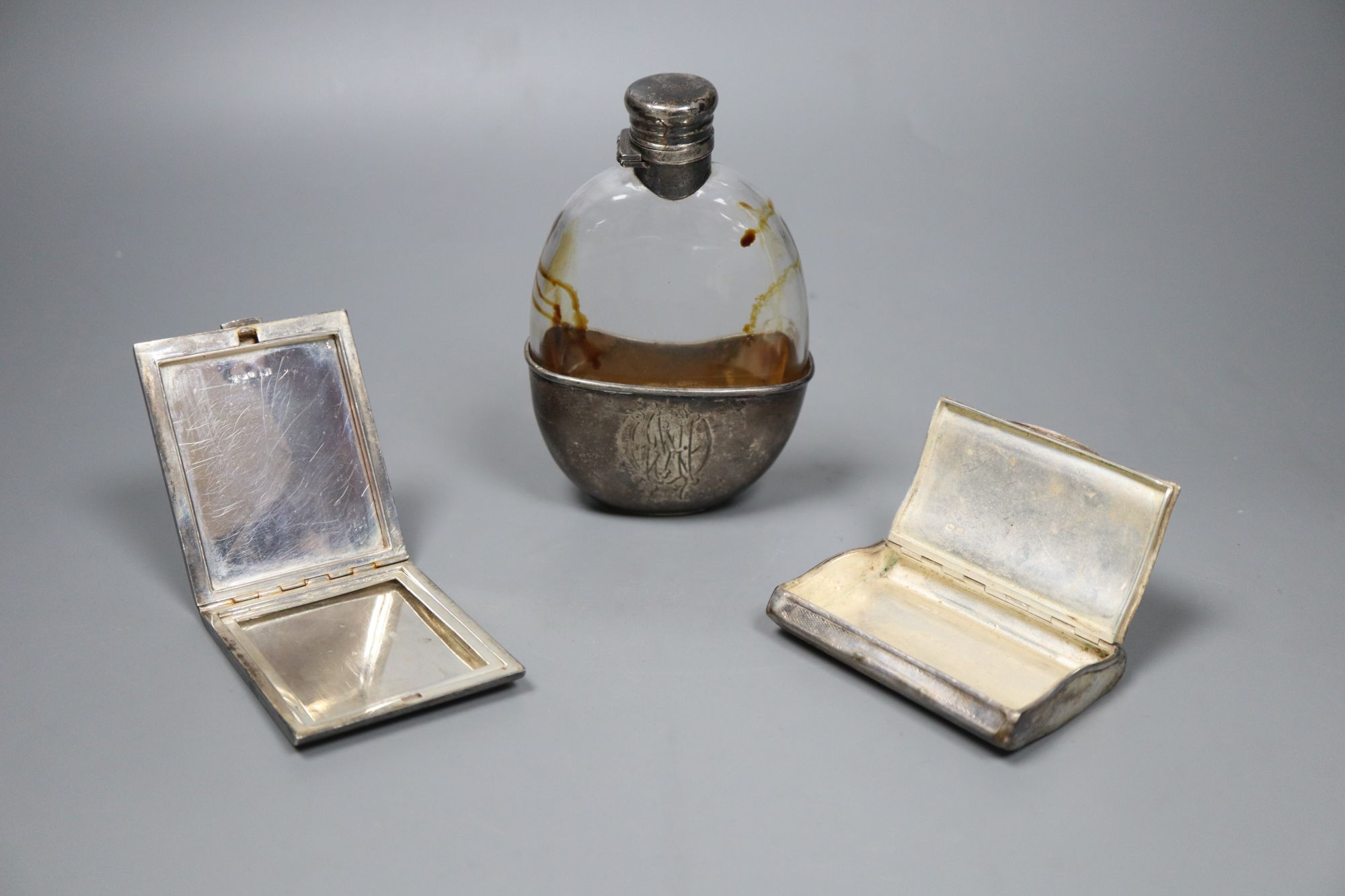 A Victorian silver-mounted glass oval hip flask, London, 1881,14cm, a later silver compact and a silver snuff box.